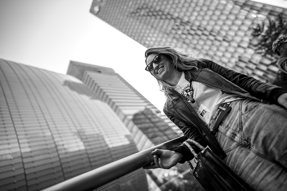 Eleni outside with tall buildings behind her