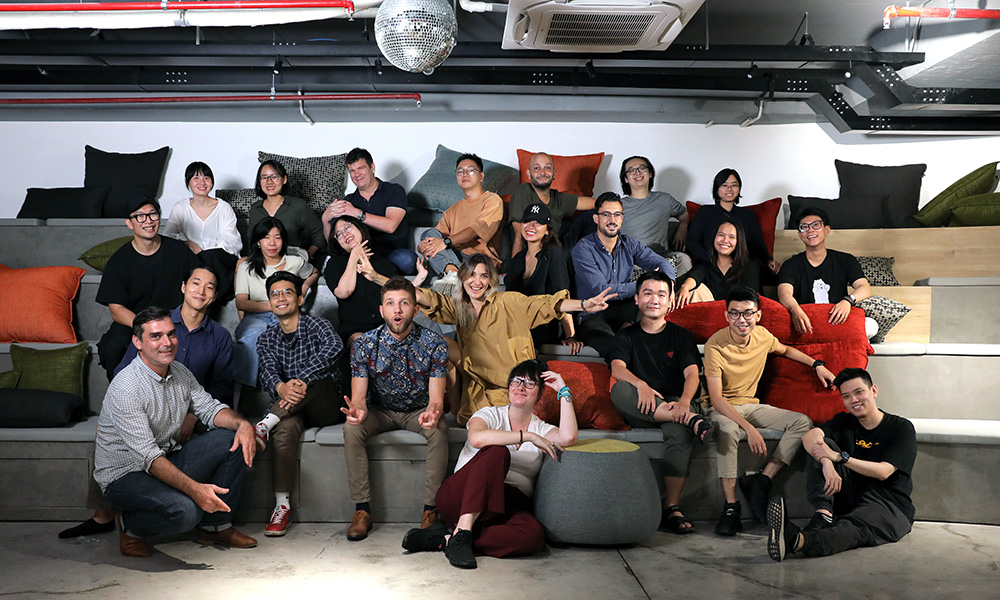 A group shot of about 20 young people sitting including Fenn