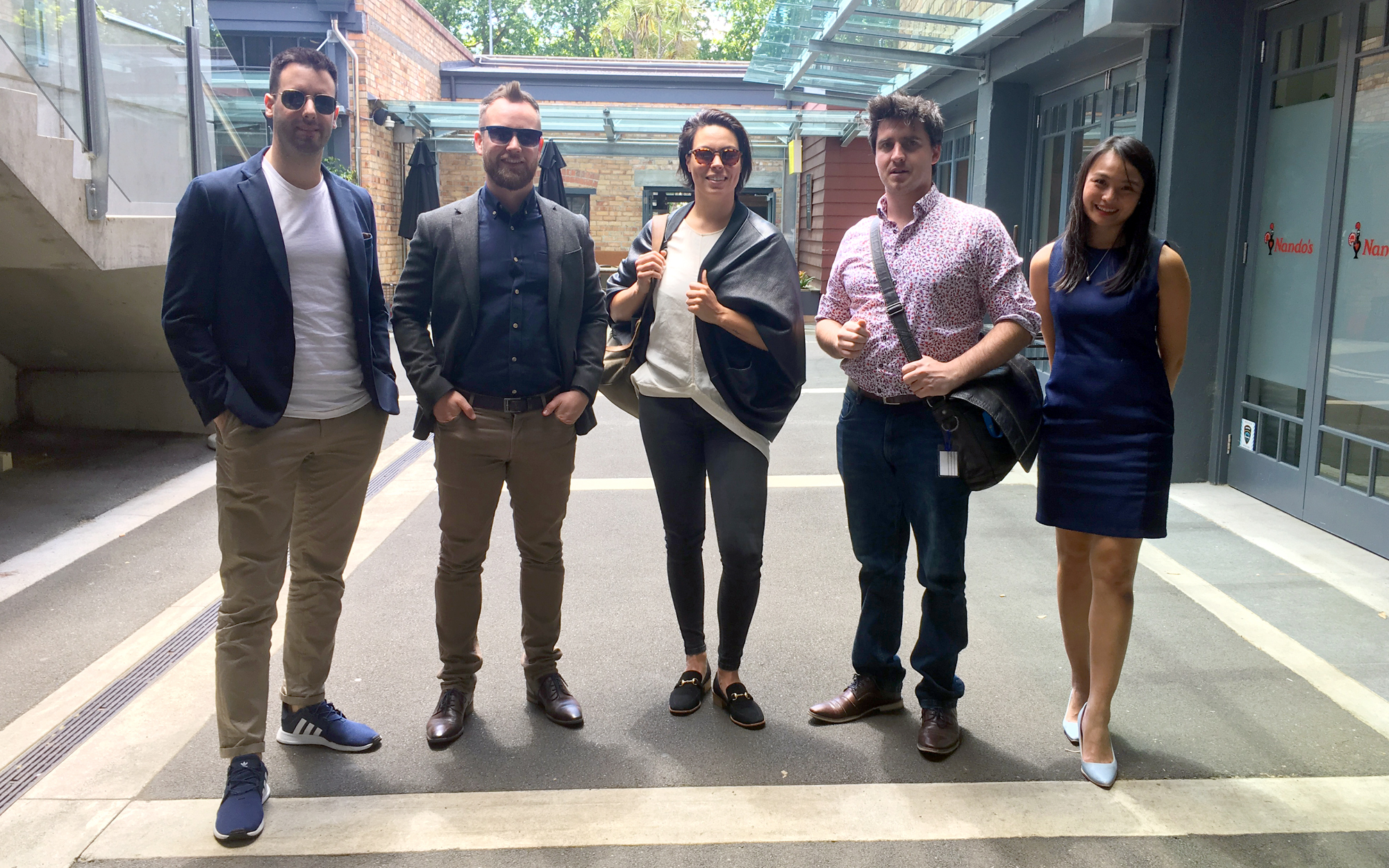Five entrepreneurs standing in a line