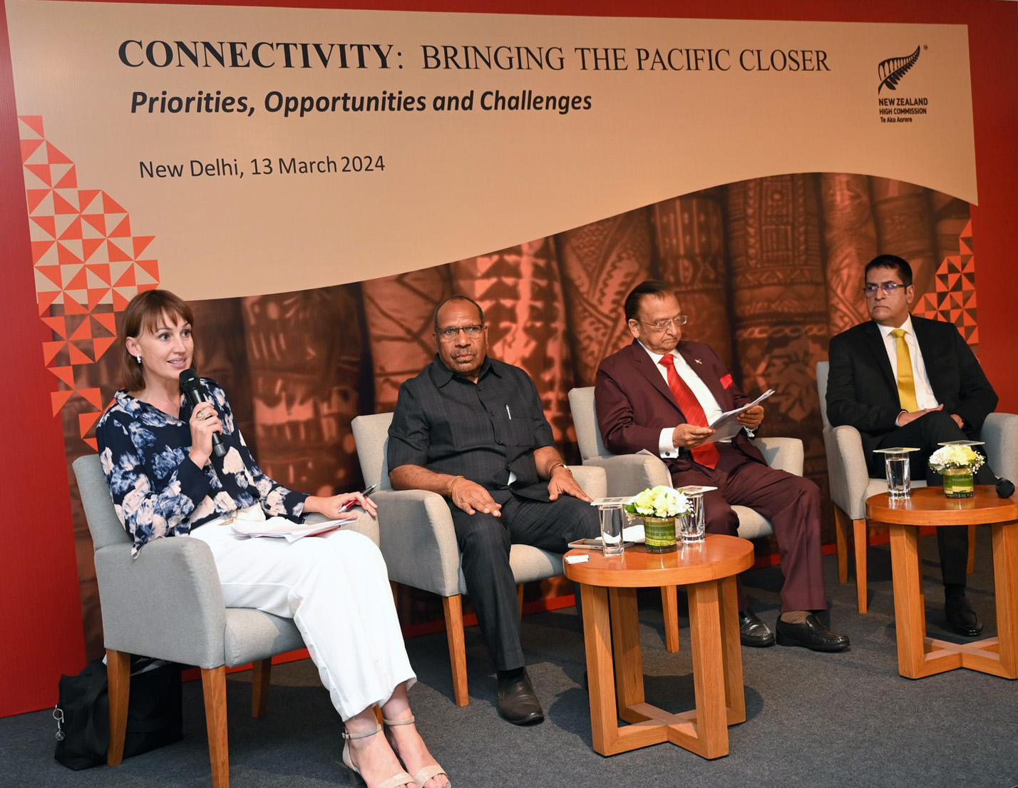 Suzannah Jessep convening a panel discussion alongside three others