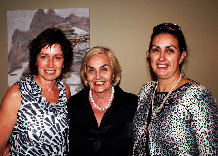 Three woman smiling at the camera