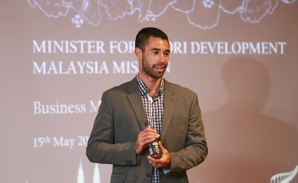 Tama presenting his drinks to an audience in Malaysia
