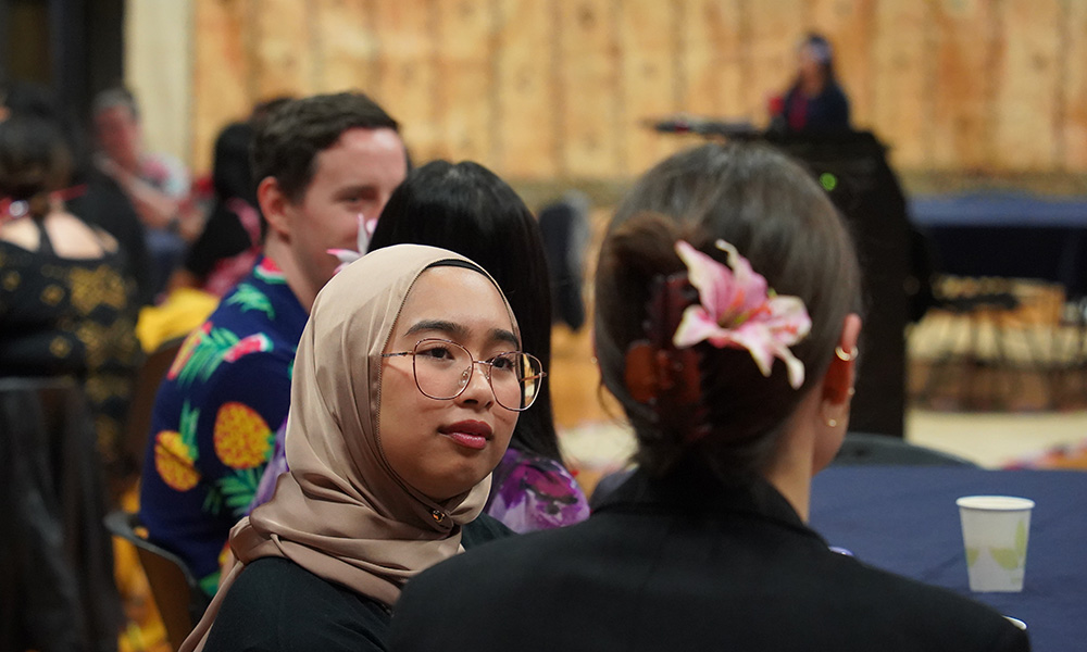 Two Leadership Network members chatting to each other in a hall