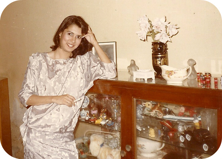 woman standing against side board