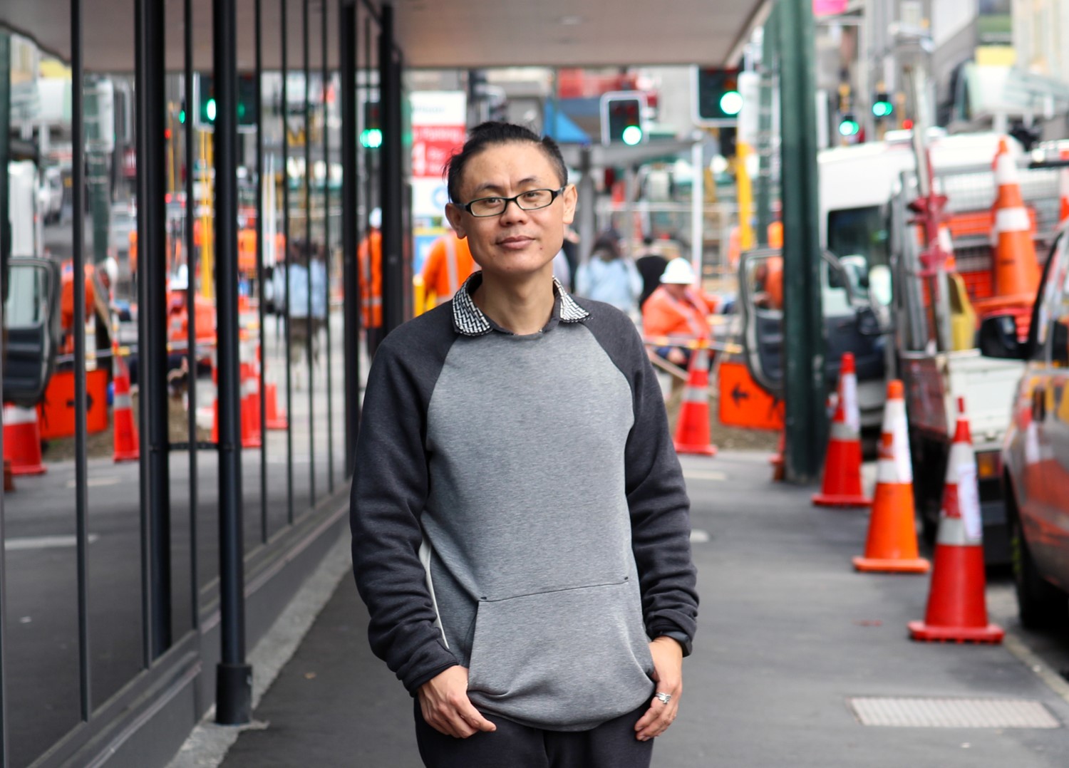 Bifei Cao standing beside Te Auaha entrance on street