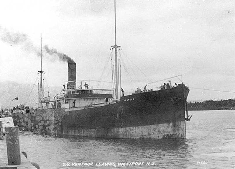 Black and white picture of a boat pulling out of a harbour