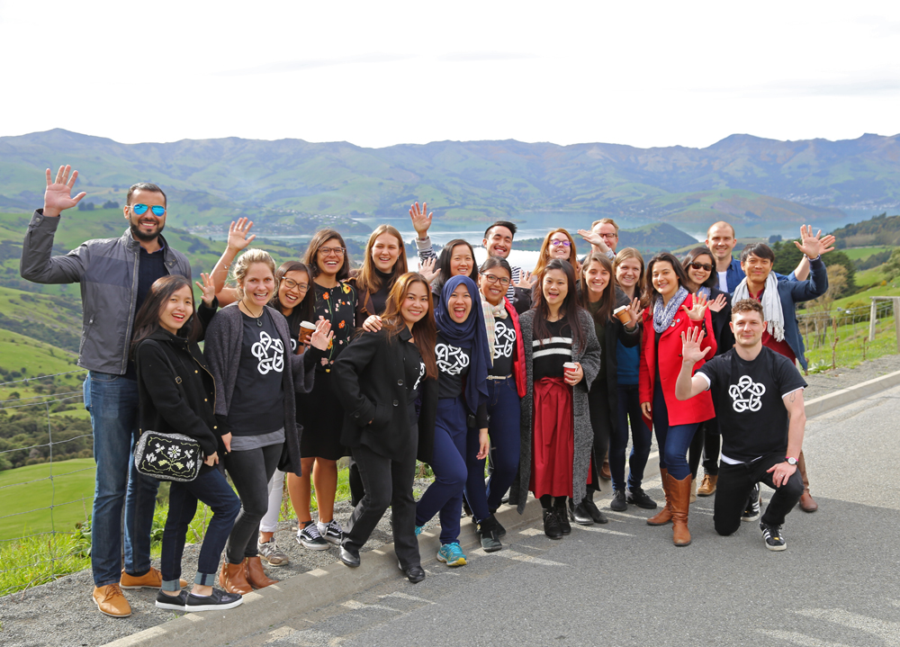 Leadership Network group standing in front of a lake