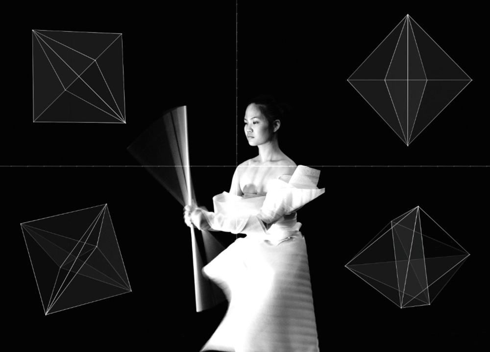 Black and white picture of dancer holding stick
