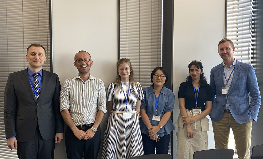 Six members of ISA conference, including Kina, panel standing in a row
