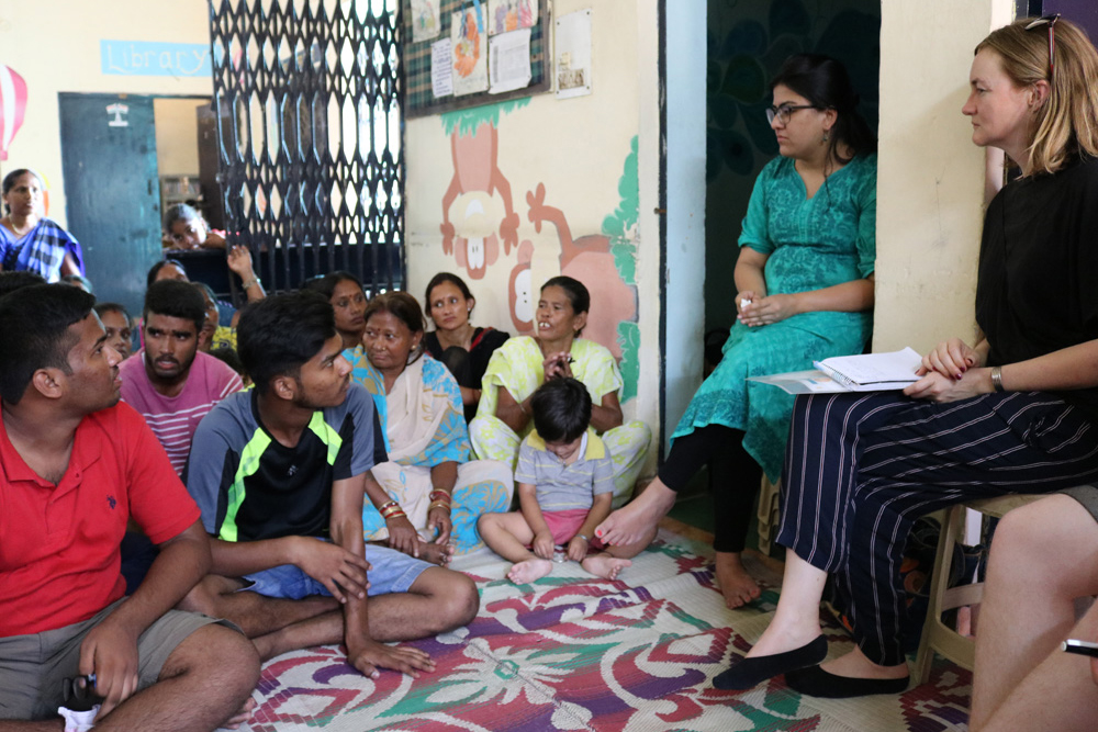 Image of journalists chatting to young Indian students