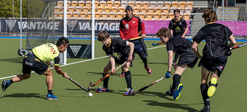 Japanese hockey players practising with a school team