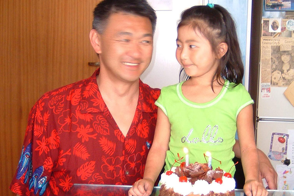 Jess as a child looking at her father