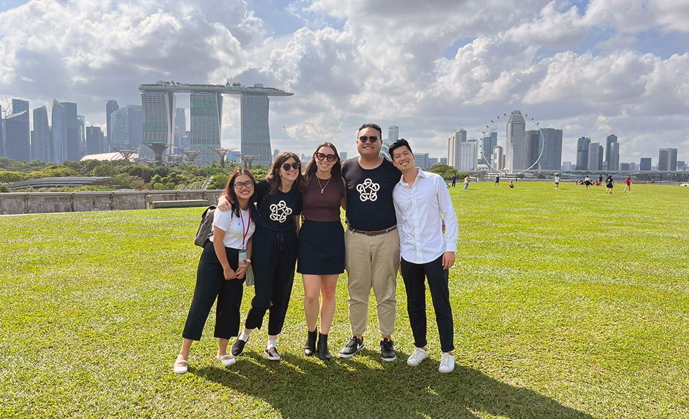 Kauri with four fellow Leadership Network members with the iconic skyline of Singapore behind them