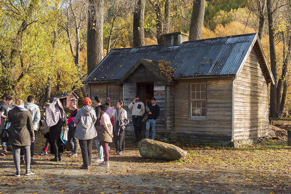 Leadership Network members looking at an old cottage