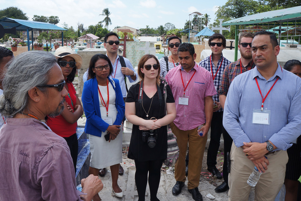 Media delegates visit a cemetary
