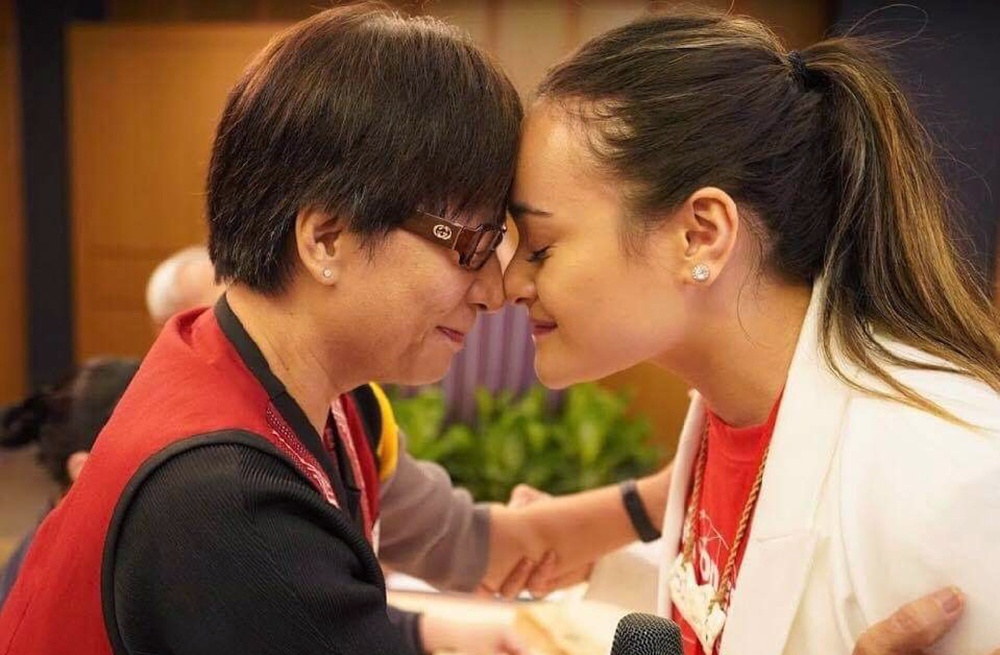 Mihi and a woman hongi