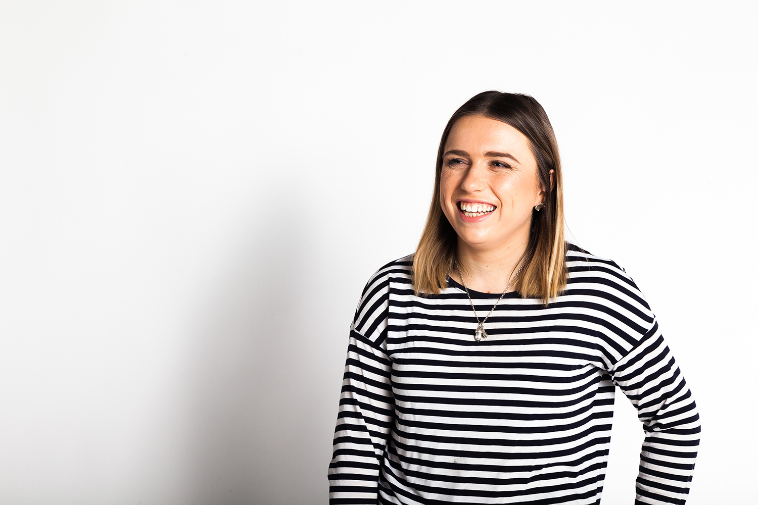 Photo of Amelia Morgan in a striped t-shirt against a white background