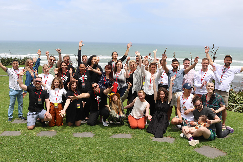 The full group posing for a photo outside