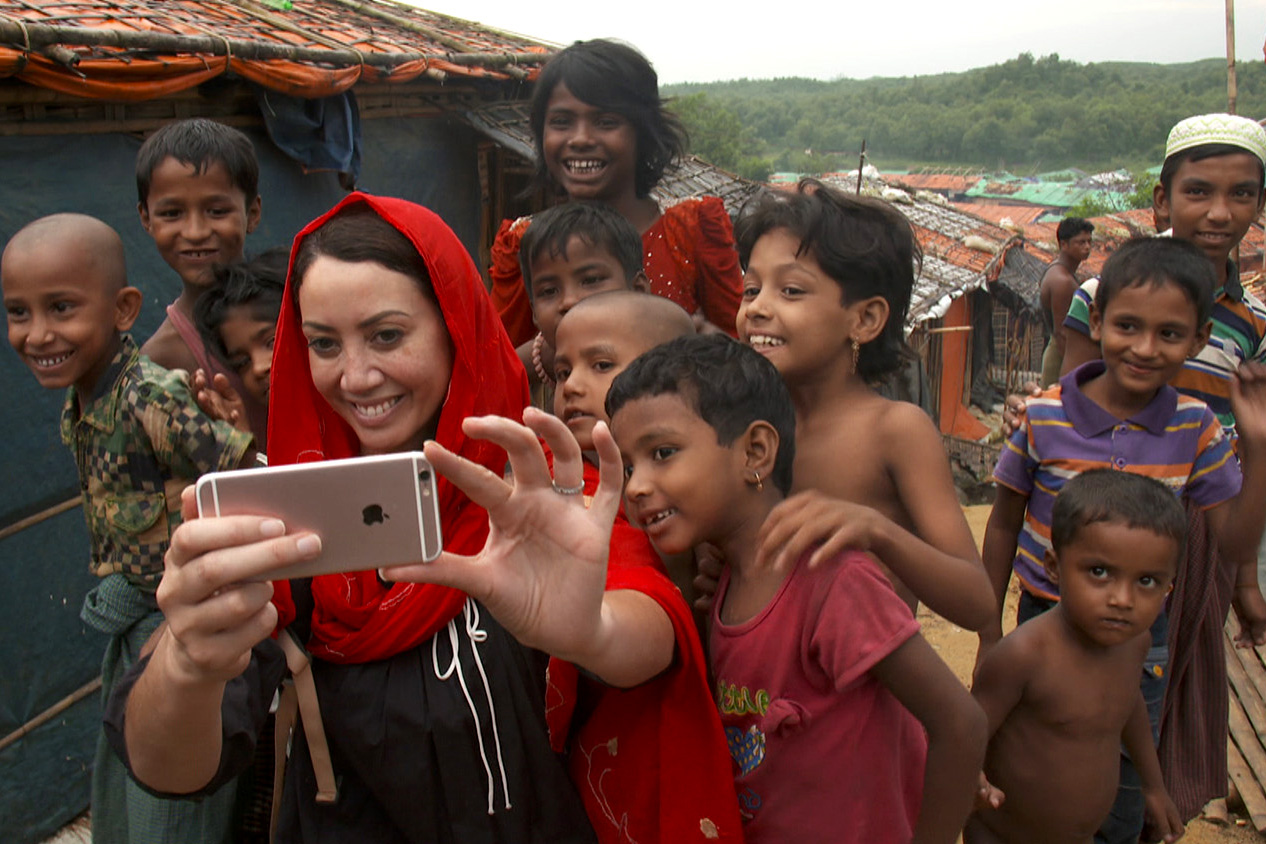 Sunday reporter Miriama Kamo taking a selfie with a group of children