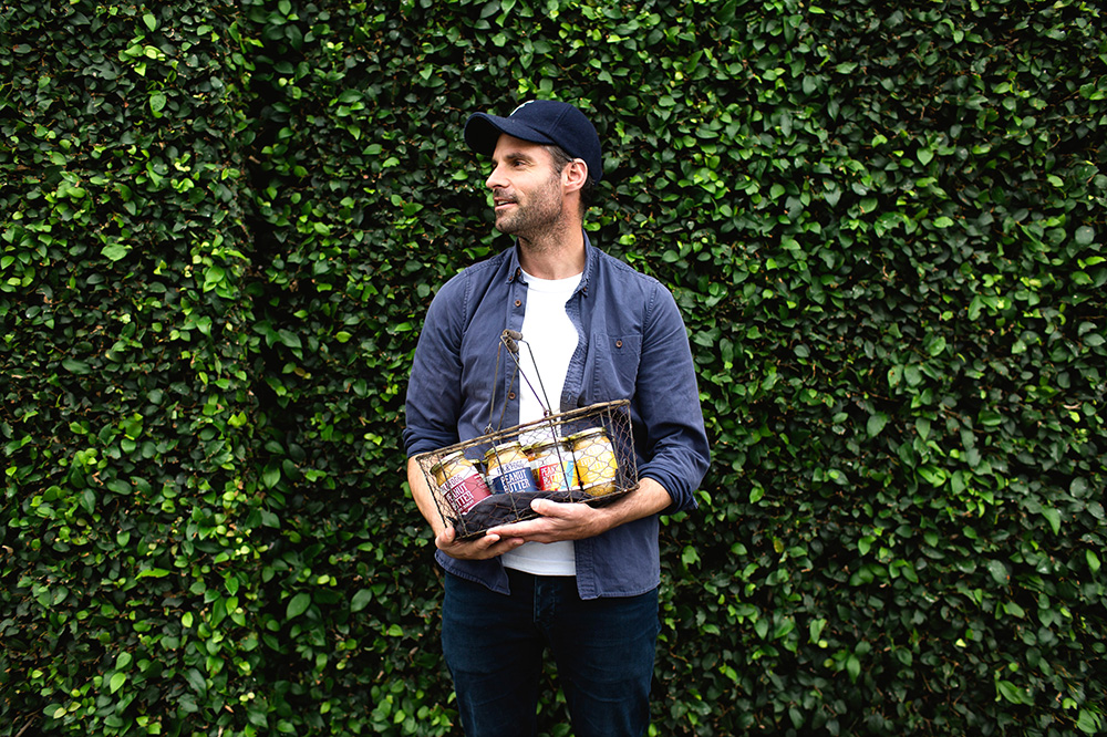 Roman holding a selection of Fix and Fogg peanut butter
