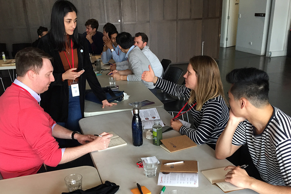 Leadership Network members chatting around a table