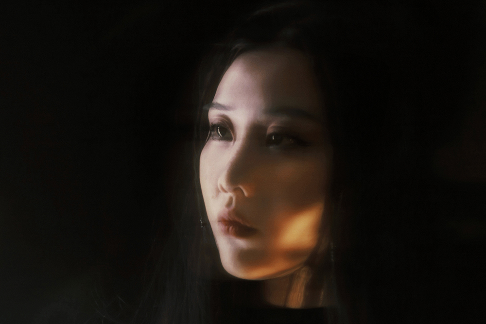 A portrait image of Xi Li