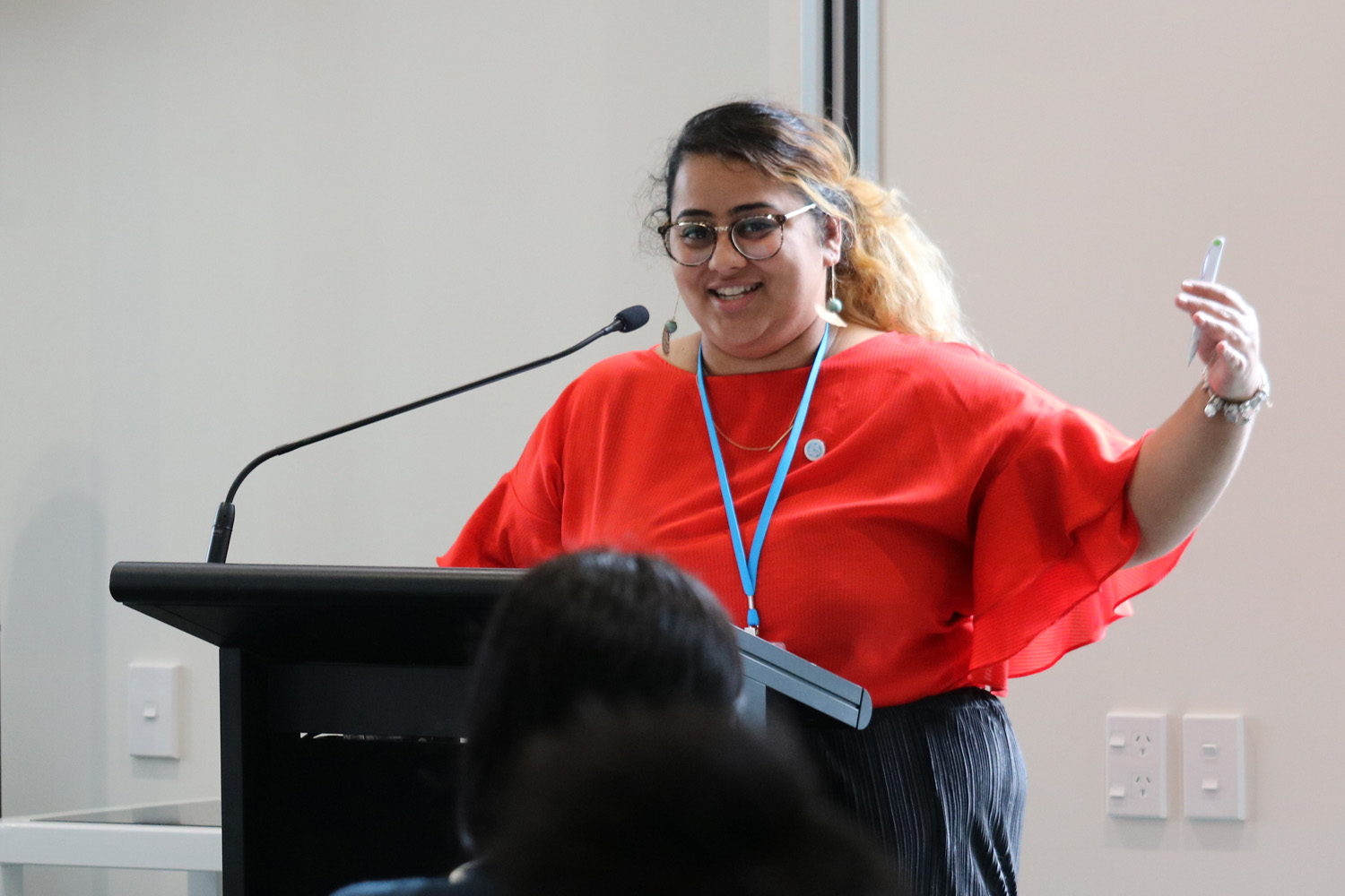 A woman speaking at a podium