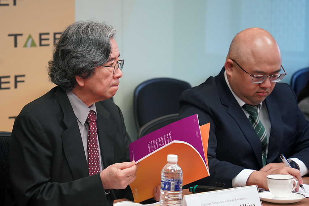 Professor Michael Hsiao, Chairman of Taiwan-Asia Exchange Foundation, looks through the last year's Perceptions of Asia report