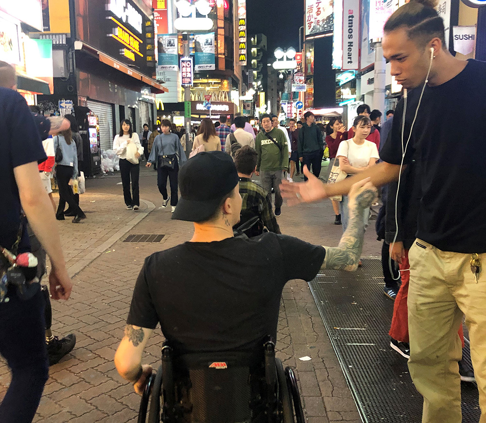 Cody meeting a guy on a neon-lit street