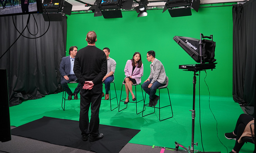 Three of the visiting agribusiness entrepreneurs being interviewed by Simon Bridges