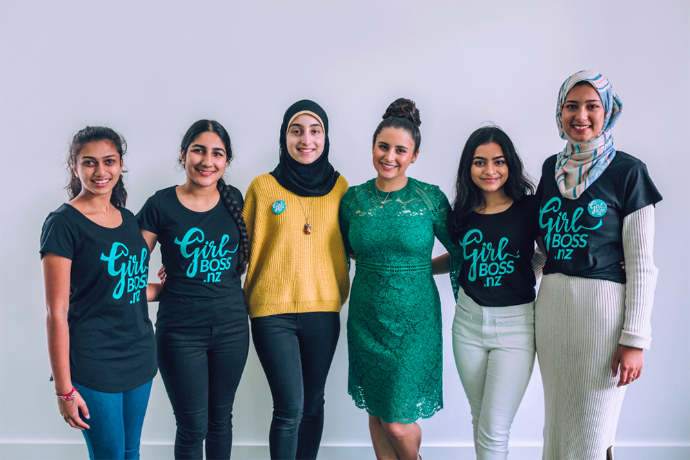 Alexia posing with five young women wearing Girlboss t-shirts