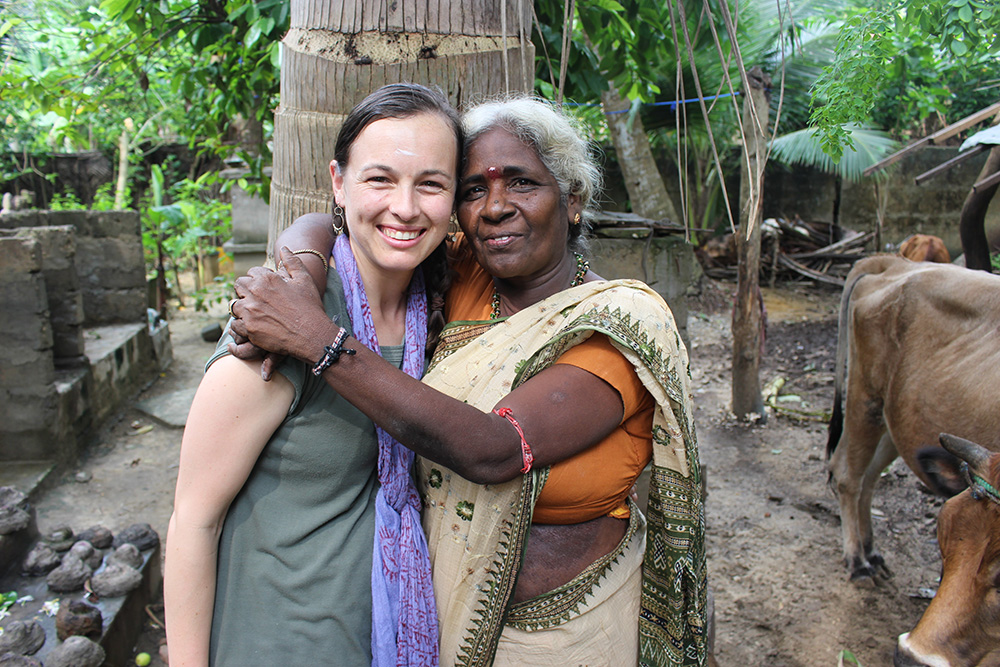 Jasmine being embraced by a woman