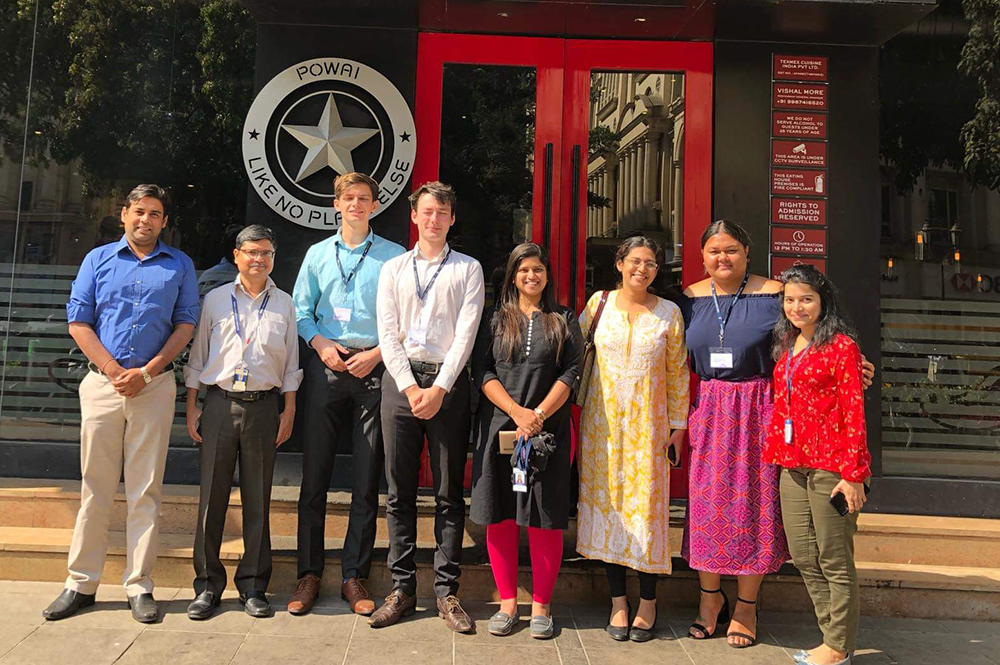 Michael Freeman (four from left) with fellow intern Jack Baucke and colleagues from Tata Consultancy Services