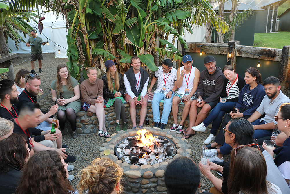 The entrepreneurs sitting round a fire pit