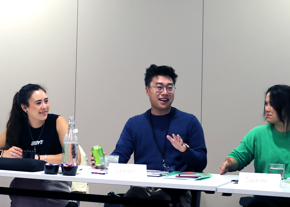 Three Leadership Network members chatting at a table
