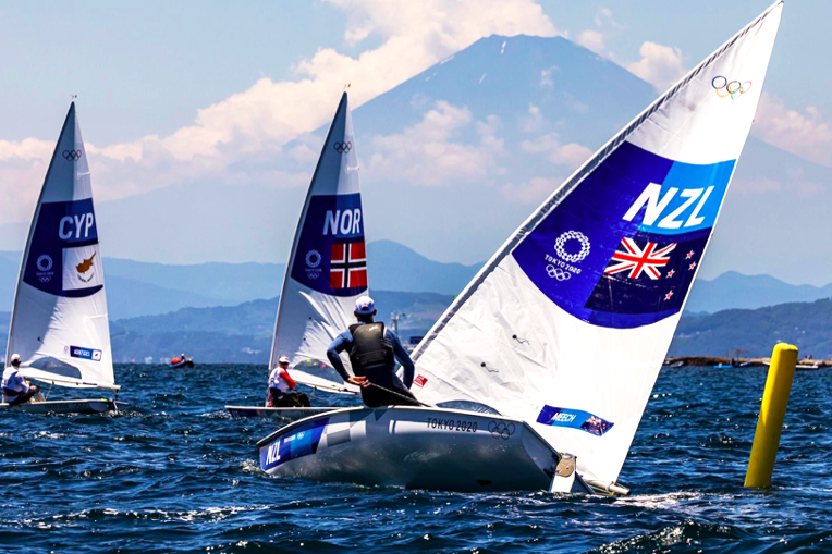 Sam in his yacht with Mount Fuji in the background