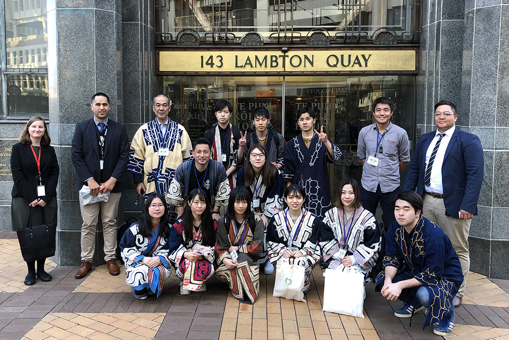 Ben with a delegation of a dozen Ainu wearing traditional dress