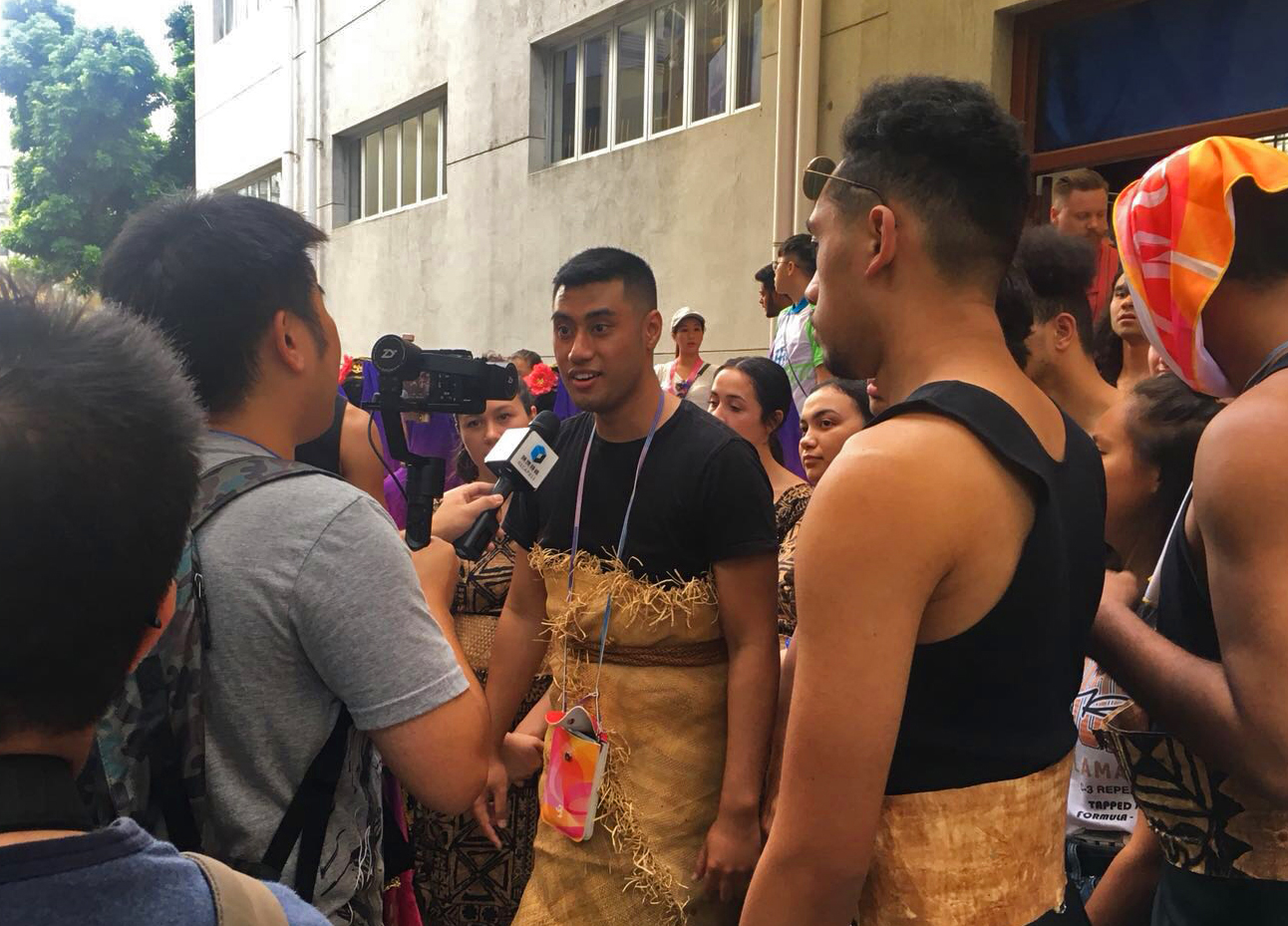 Xavier speaking to a reporter