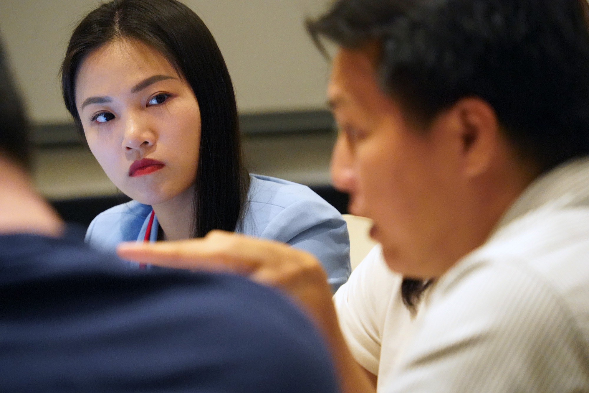 A participant listening to a fellow participant speak