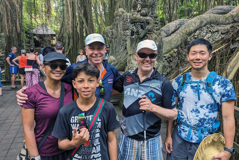 Five members of the New Zealand team posing for a photo in the Monkey Forest