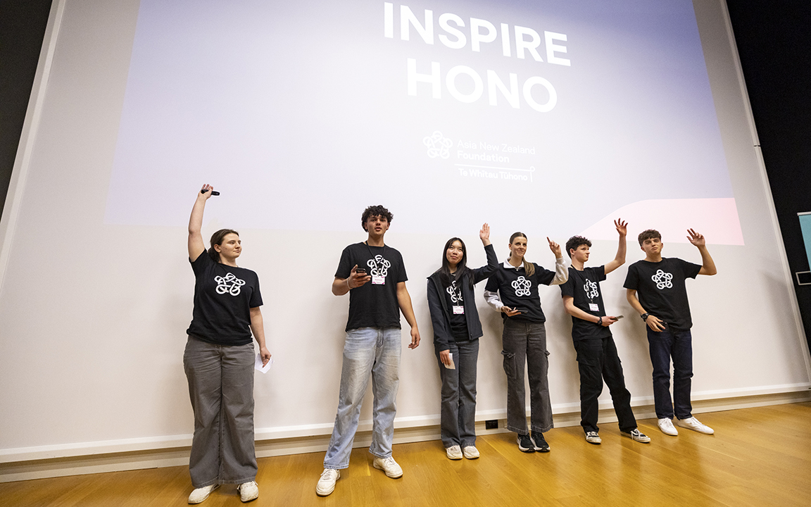 The team of six budding entrepreneurs standing on stage accepting their accolades