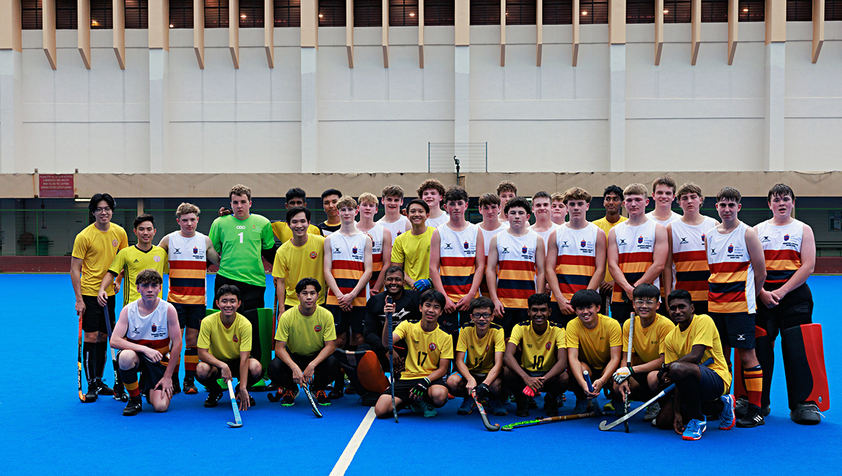 The NZ players posing for a group photo with a Malaysian team