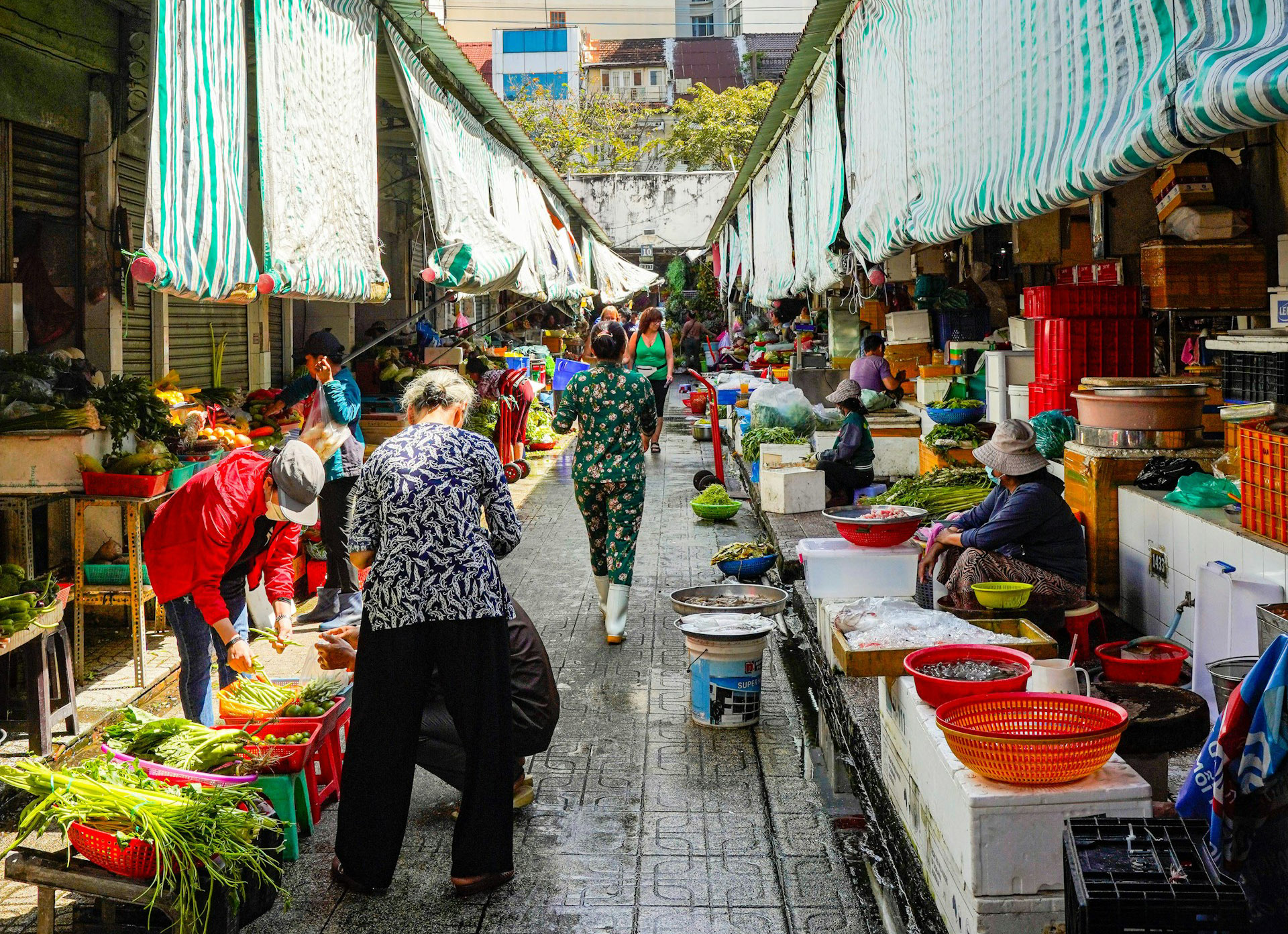 A market scene showing market holders selling vegetables