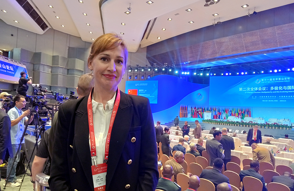 Suzannah Jessep standing in an auditorium