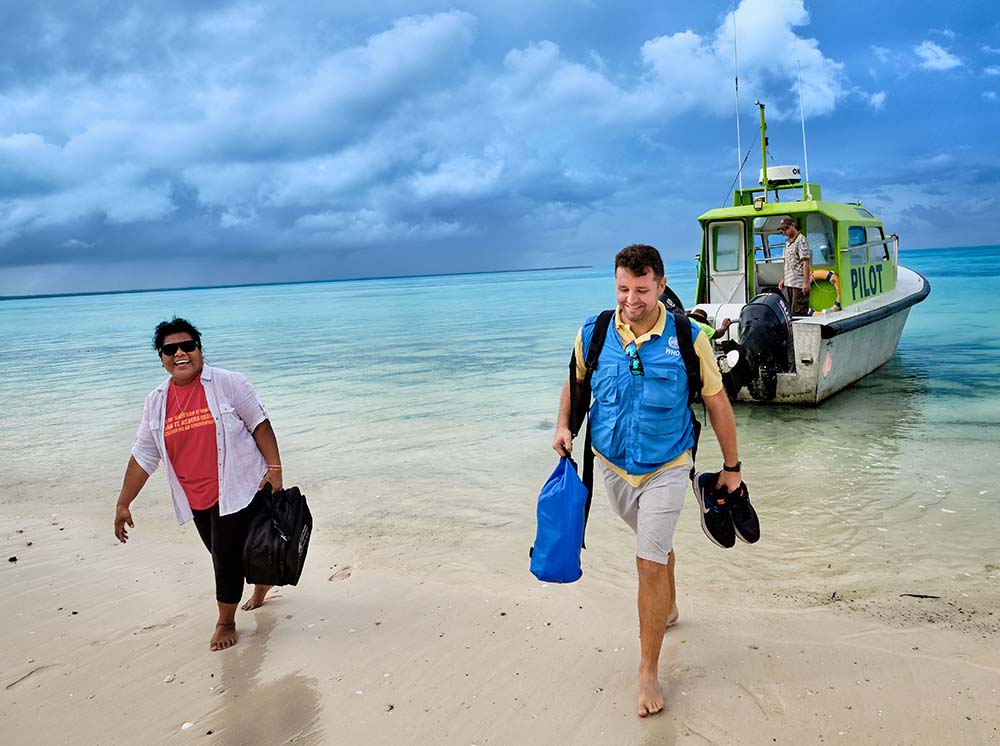 Will walking up a beach with a woman after disembarking from a pilot boat