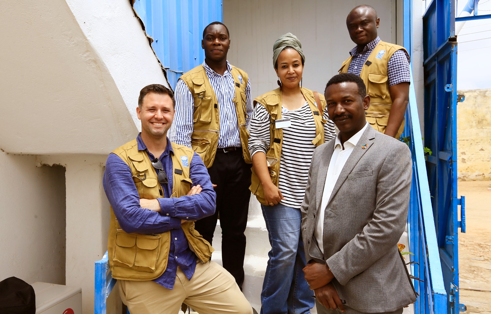 Will and colleagues standing on steps