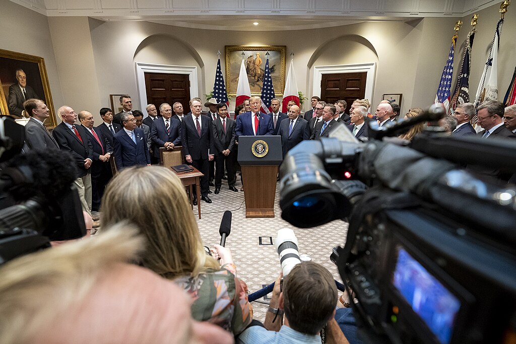Former President Donald Trump adressing reporters from a lectern