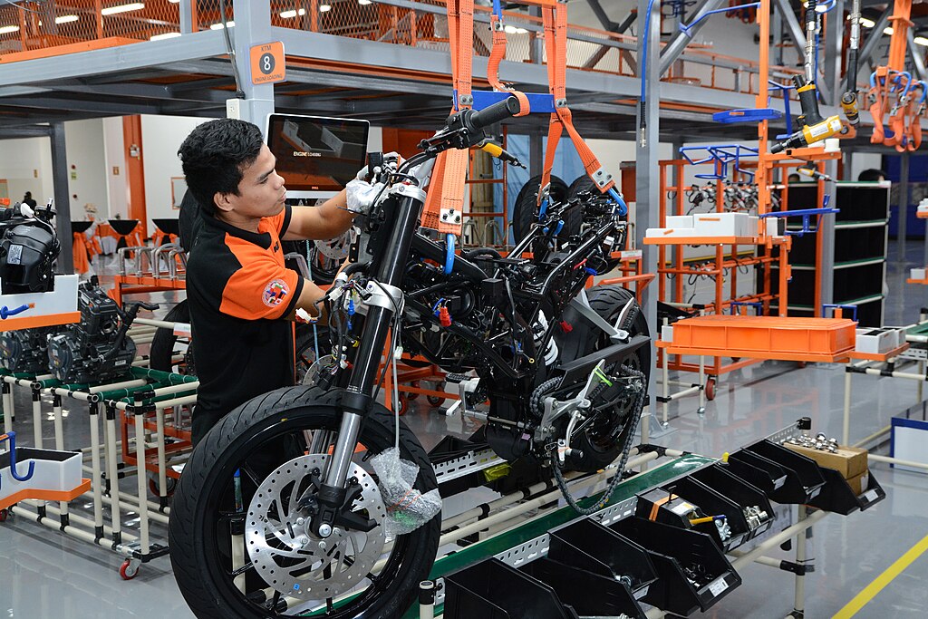 A worker assembling a motorcycle in the Philippines
