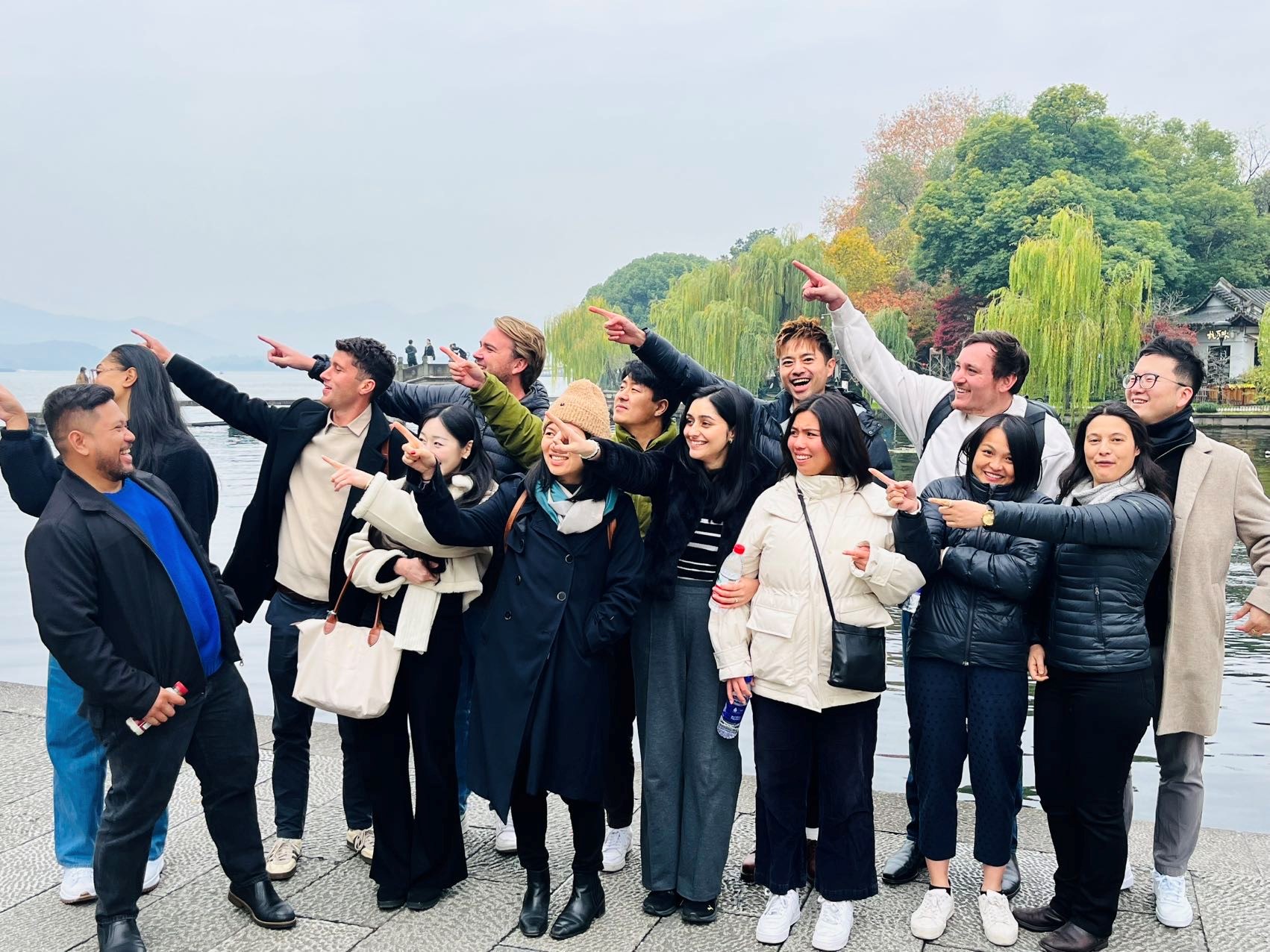 Leadership Network members dressed in warm clothing and all pointing in one direction