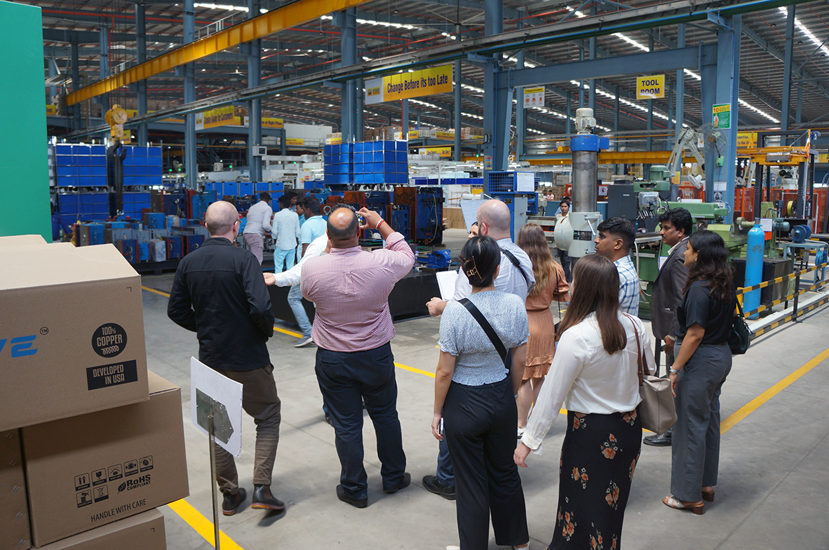 The New Zealand delagation inside a factory